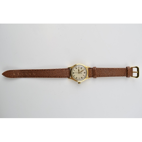 335 - Cyma 9ct gold gents manual wristwatch on leather strap, 30mm, in working order.