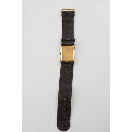 336 - 18ct gold and white gold cased vintage manual rectangular wristwatch, on leather strap, circa 1928, ... 