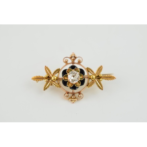 389 - 14k gold floral brooch, set with central diamond, circa 0.45/0.5ct, with black enamel, 3.8 grams, 35... 