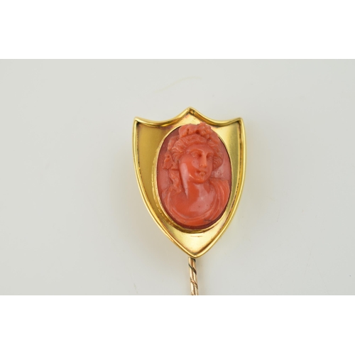 397 - Victorian 9ct gold shield-shaped stick pin with large coral cameo, gross weight 11.4 grams, 10cm lon... 