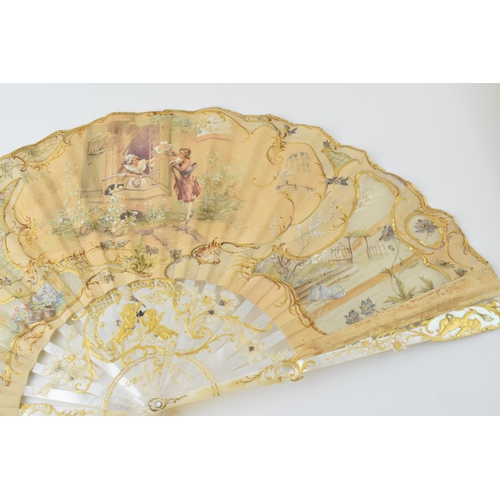 78 - Edwardian silk decorated fan with highly worked and gilded mother of pearl front & rear, and in orig... 