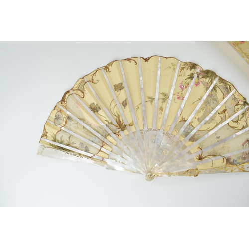 78 - Edwardian silk decorated fan with highly worked and gilded mother of pearl front & rear, and in orig... 