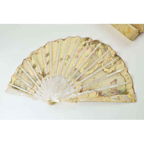 78 - Edwardian silk decorated fan with highly worked and gilded mother of pearl front & rear, and in orig... 