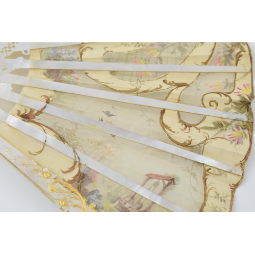 78 - Edwardian silk decorated fan with highly worked and gilded mother of pearl front & rear, and in orig... 