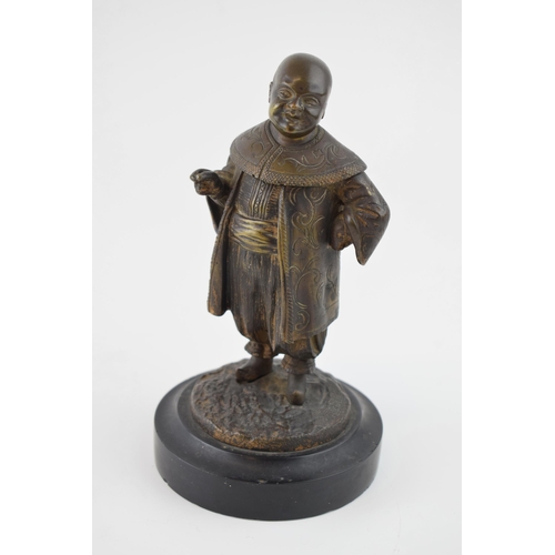 86 - Bronze figure of a Chinese gentleman in traditional costume, mounted onto slate base, in the form of... 