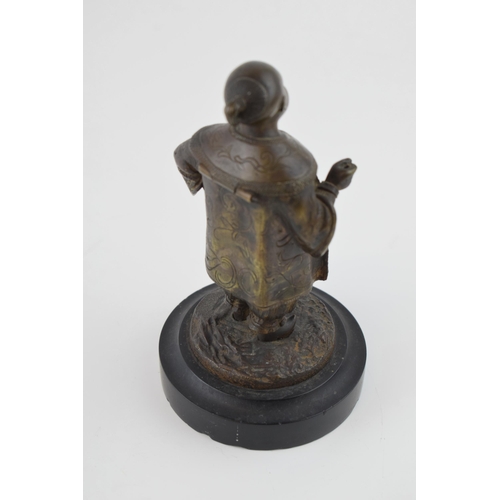 86 - Bronze figure of a Chinese gentleman in traditional costume, mounted onto slate base, in the form of... 