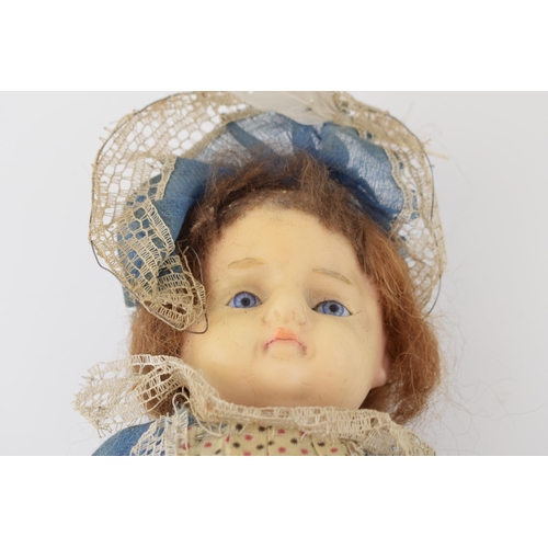 150 - Wax head antique doll in blue dress c1860. Height 54cm.