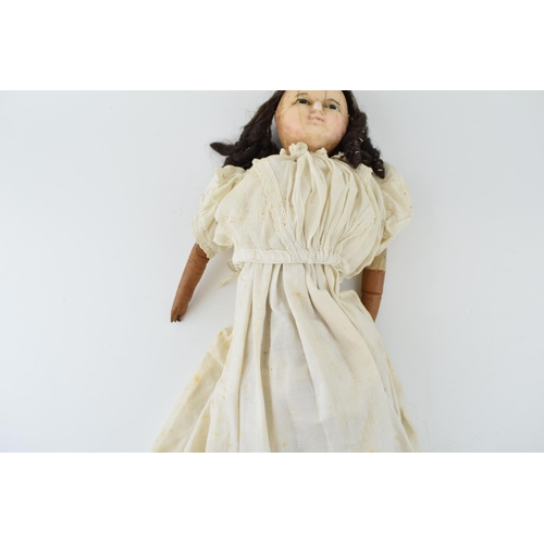 151 - Wax head antique doll in white dress with leather arms. Height 59cm. c1840.