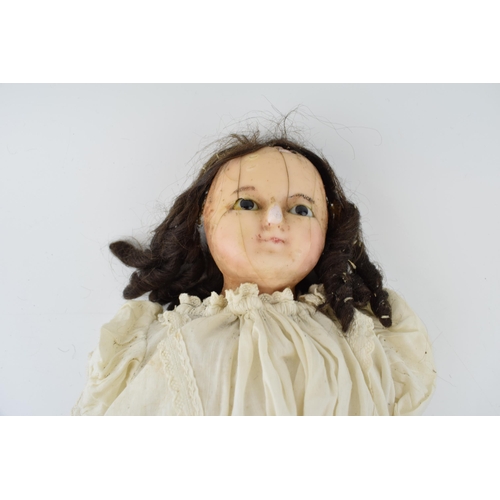 151 - Wax head antique doll in white dress with leather arms. Height 59cm. c1840.