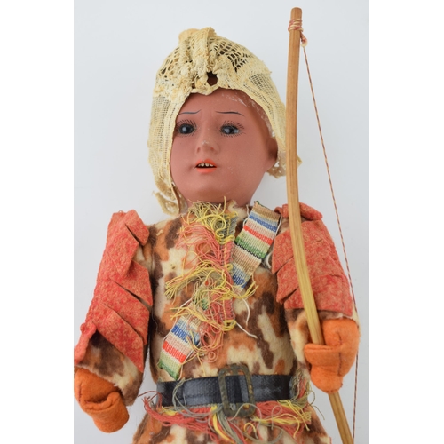 153 - Antique AM male doll, Made in Germany 14/0. Dressed in hunting attire with bow and shelf. Height 32c... 