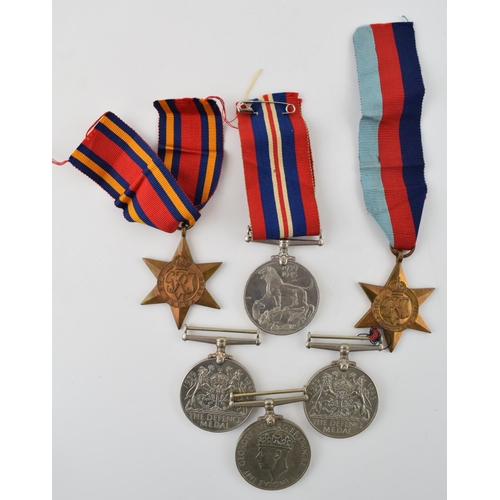 160 - Two groups of WWII medals to include The Defence Medal (2) one with original ribbon, 1939 - 1945 med... 