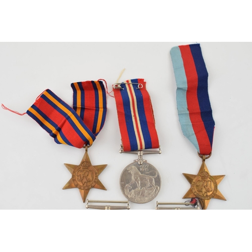 160 - Two groups of WWII medals to include The Defence Medal (2) one with original ribbon, 1939 - 1945 med... 