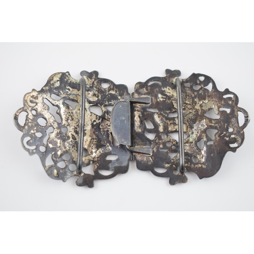 194 - Hallmarked silver ornate nurse's belt buckle, 50.6 grams, of a deer hunting scene with huntsman and ... 