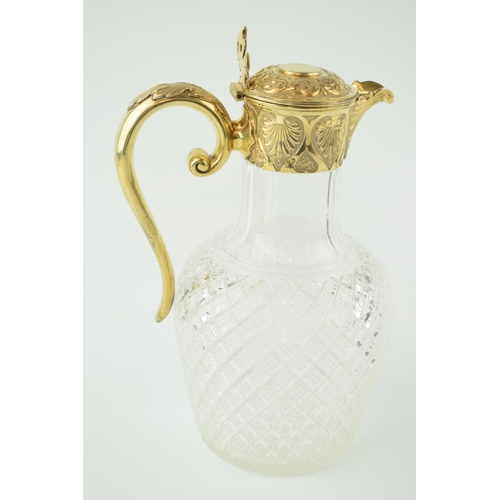 197 - Silver gilt mounted claret jug, London George Fox, 1887 with associated stopper. Height 22.5cm.