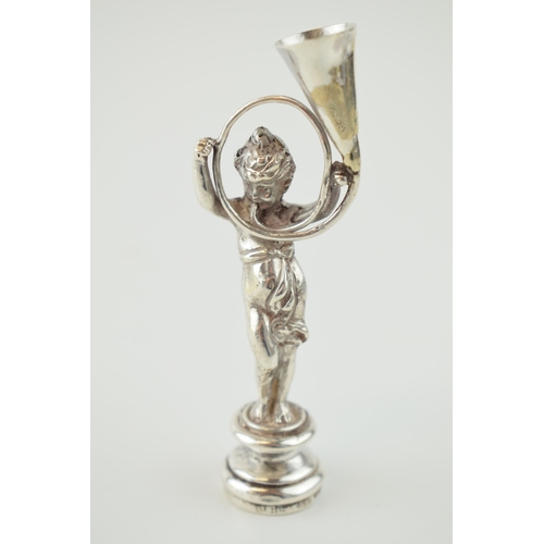 213 - A late 19th century silver figural desk seal, import marks for Berthold Muller, 9cm tall.