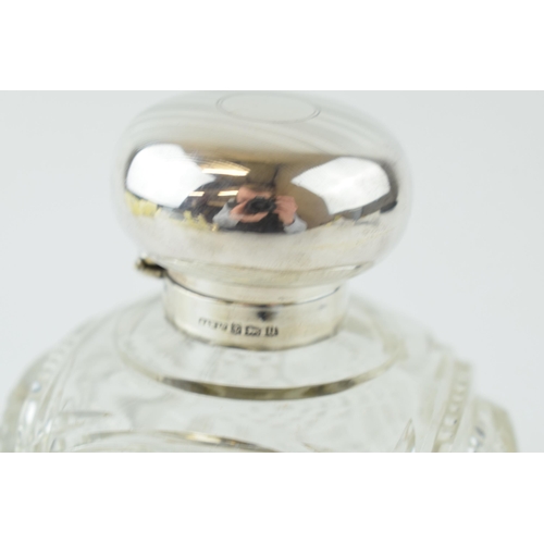 245 - Silver topped cut glass perfume bottle, with glass stopper, Birm 1919, H and H Ltd, 11cm tall.