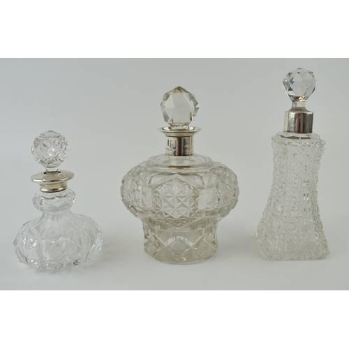 256 - A large Edwardian silver collared and glass scent bottle, Chester 1905, 12cm tall, with 2 similar, B... 