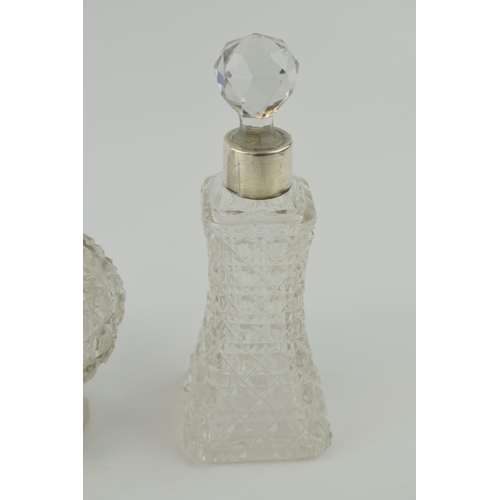 256 - A large Edwardian silver collared and glass scent bottle, Chester 1905, 12cm tall, with 2 similar, B... 