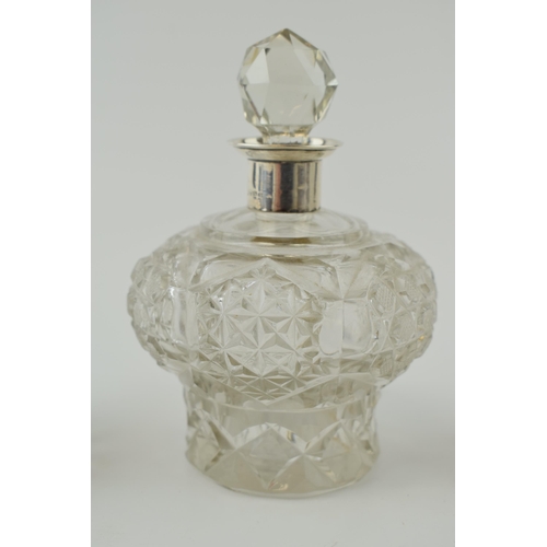 256 - A large Edwardian silver collared and glass scent bottle, Chester 1905, 12cm tall, with 2 similar, B... 