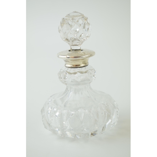 256 - A large Edwardian silver collared and glass scent bottle, Chester 1905, 12cm tall, with 2 similar, B... 