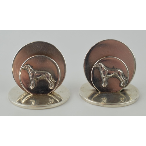 257 - A pair of hallmarked silver menu holders / place setting holders, with whippets / greyhounds, London... 