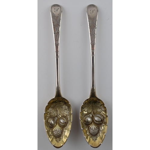 264 - A pair of large Georgian silver spoons with embossed fruit decoration bowls, 144.4 grams, London 181... 