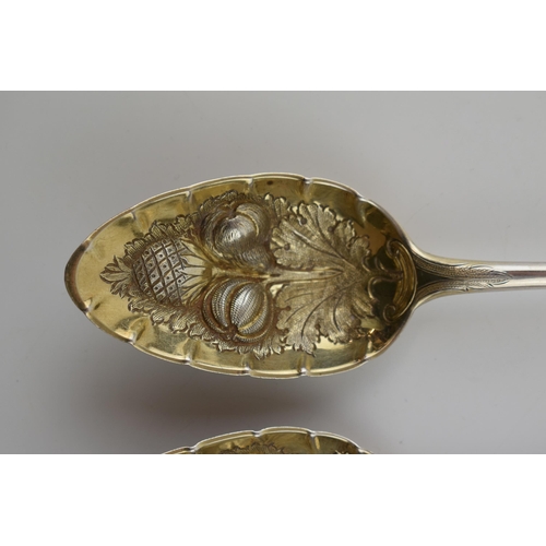 264 - A pair of large Georgian silver spoons with embossed fruit decoration bowls, 144.4 grams, London 181... 