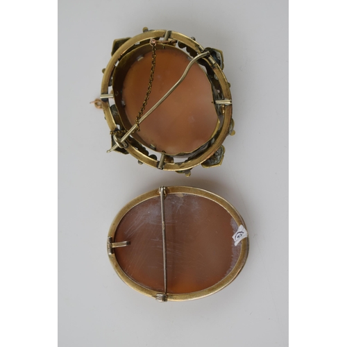 268 - A pair of vintage cameo brooches, both depicting the three graces, metal frames (2), 6cm tall.