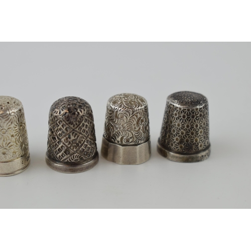 273 - A collection of five silver thimbles of varying styles, 21.4 grams (5).