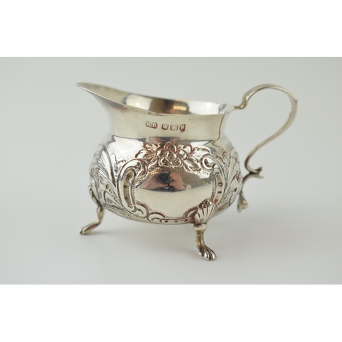 277 - Silver embossed small jug, claw feet, Sheffield 1898, 58.6 grams, 8cm wide.