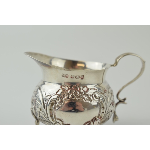 277 - Silver embossed small jug, claw feet, Sheffield 1898, 58.6 grams, 8cm wide.