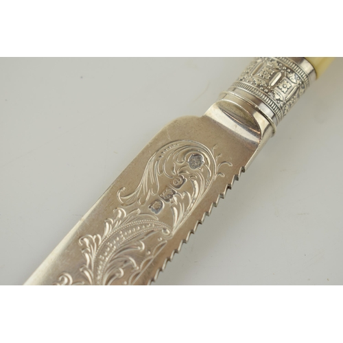 285 - Victorian silver bread knife with ornate blade, London 1900, with a silver bread fork, Birm 1902 (2)... 