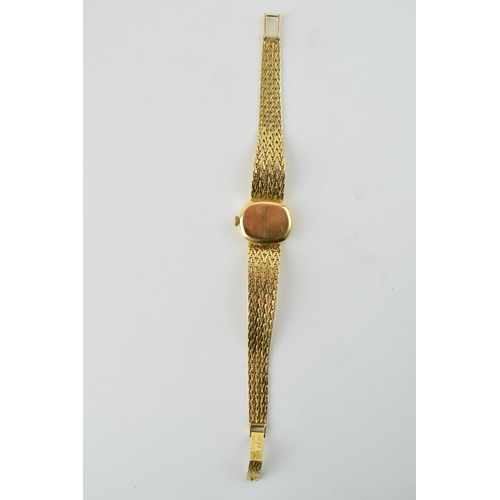 307 - A ladies Omega De Ville 18ct gold wristwatch. Goldtone dial with applied baton markers. 18ct gold br... 