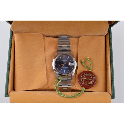 310 - A Rolex Oyster Perpetual Date gentleman's wristwatch. Blue circular dial  with applied baton markers... 