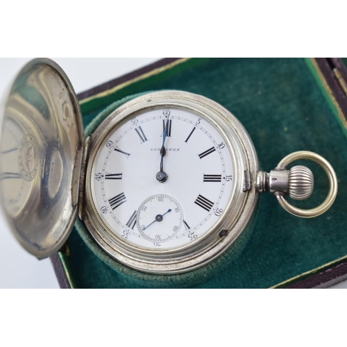 319 - Longines silver full hunter pocket watch marked .800 to inner case. White ceramic dial with Roman nu... 