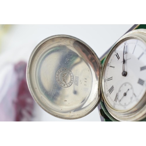 319 - Longines silver full hunter pocket watch marked .800 to inner case. White ceramic dial with Roman nu... 