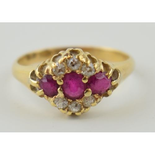 341 - An 18ct yellow gold ladies ring set with three rubies and diamonds. Size P 1/2. Gross weight 3.7 gra... 