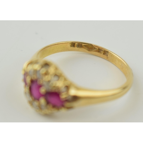 341 - An 18ct yellow gold ladies ring set with three rubies and diamonds. Size P 1/2. Gross weight 3.7 gra... 