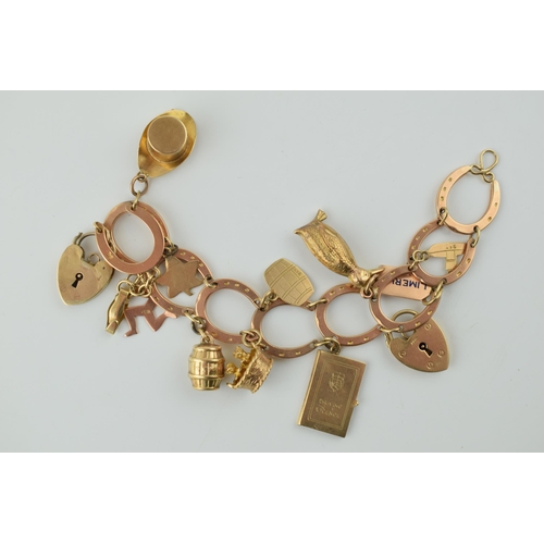 350 - 9ct rose gold horseshoe themed charm bracelet  and containing 12 x 9ct charms, including padlock.  W... 