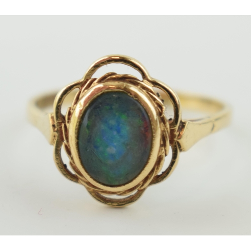 357 - 9ct gold and opal ring, stone badly scratched, and glued from behind. weight 3.3g.  Size W.