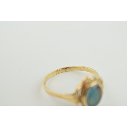 357 - 9ct gold and opal ring, stone badly scratched, and glued from behind. weight 3.3g.  Size W.