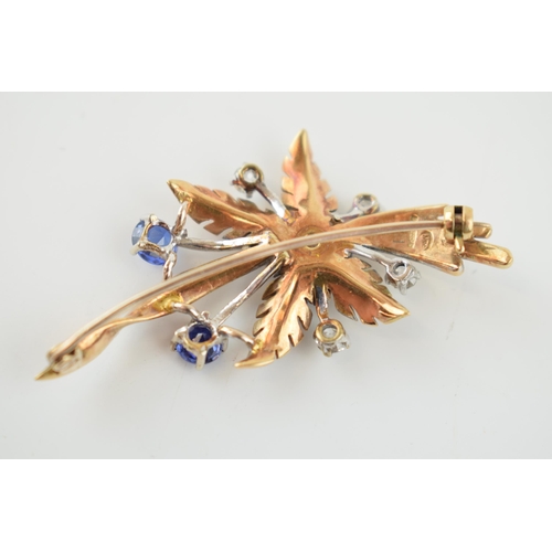 367 - A 9ct yellow gold floral spray brooch, claw set four old-cut diamonds and three round-cut sapphores ... 