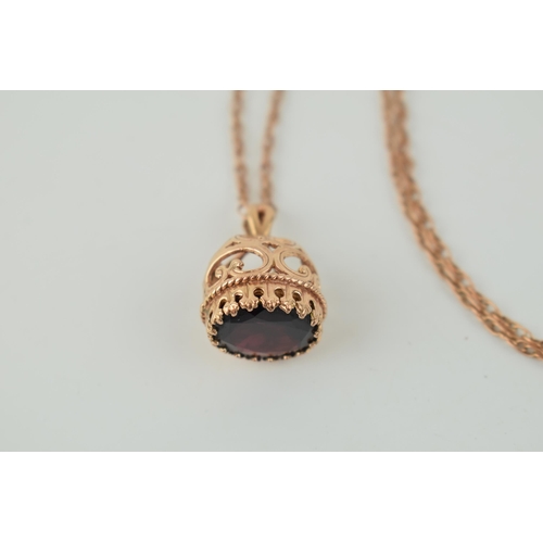 369 - 9ct rose gold fob, set oval-cut garnet, on fine 9ct chain (clasp af), total weight 9.9 grams.