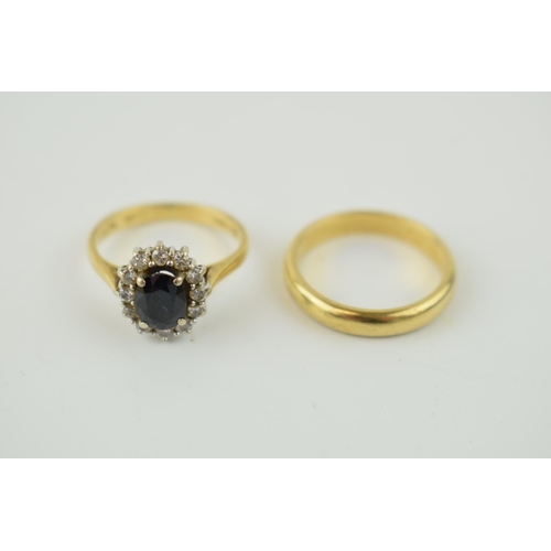 371 - An 18ct yellow gold wedding band, 3.6 grams, size K, with an 18ct gold sapphire and diamond cluster ... 