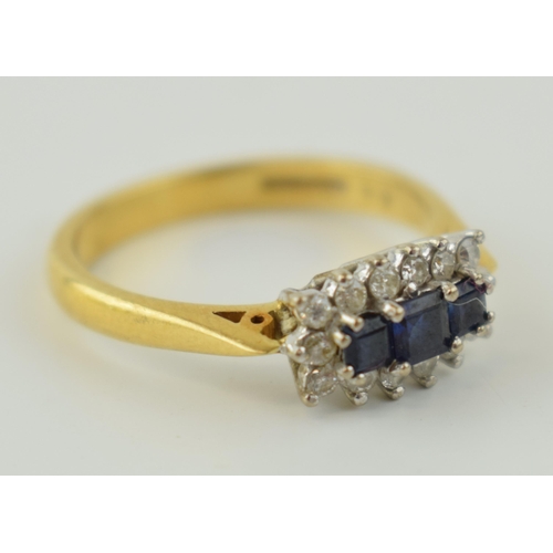 372 - 18ct sapphire and diamond ring with three square-cut sapphires surrounded by 14 diamonds, size P/Q, ... 