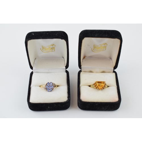 374 - A pair of 9ct gold rings, set citrine and tanzanite, combined 5.7 grams, 1 with certificate (2).