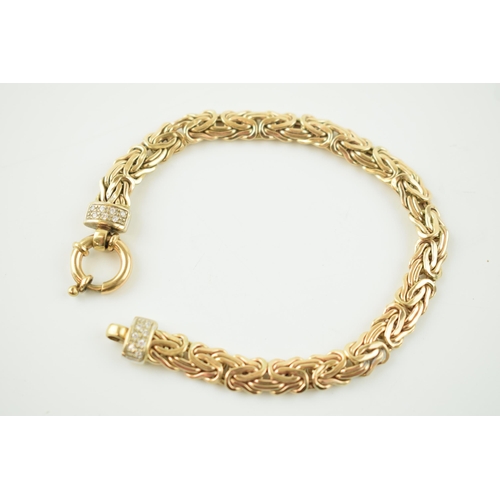 375 - 9ct yellow gold fancy link bracelet, highlighted with white stone collars, 10.9 grams, 19.5cm long.