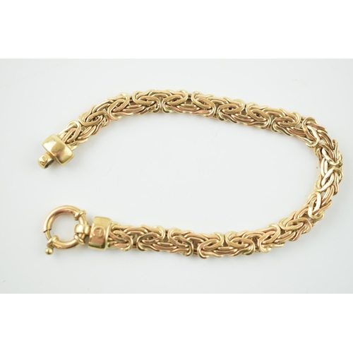 375 - 9ct yellow gold fancy link bracelet, highlighted with white stone collars, 10.9 grams, 19.5cm long.