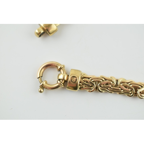 375 - 9ct yellow gold fancy link bracelet, highlighted with white stone collars, 10.9 grams, 19.5cm long.