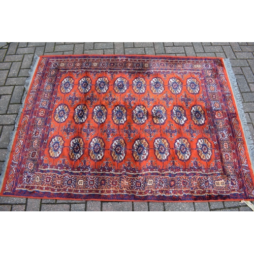 74 - Bokhara carpet in cashmere and silk. Traditional elephants foot pattern with stylised floral boarder... 